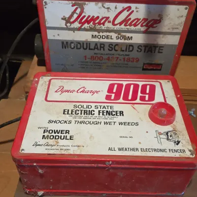 Two Dyna-charge 909 electric fence chargers