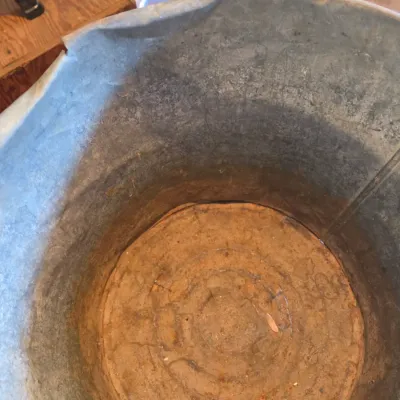 Two vintage metal buckets