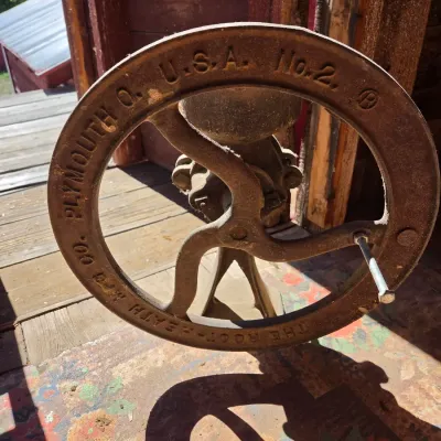 Antique Root-Heath Mfg. Co. "Korn King" No. 2 cast iron grist and corn mill, featuring a hand-crank flywheel marked with...