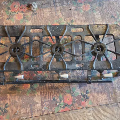Vintage cast-iron three-burner camp stove with porcelain handles marked 137 on bottom Possibly a Griswold?