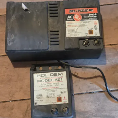 Two electric fence chargers - Blitzer 8900-B and a Hol-Dem model 501
