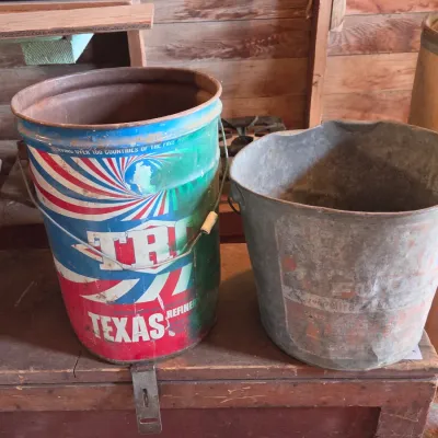 Two vintage metal buckets