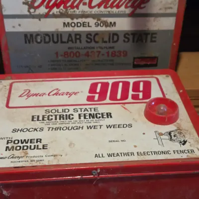 Two Dyna-charge 909 electric fence chargers