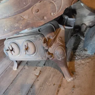 Antique cast-iron "oak-style" pot-belly stove, which reads "BONNY OAK" on the upper front door - appears complete and...