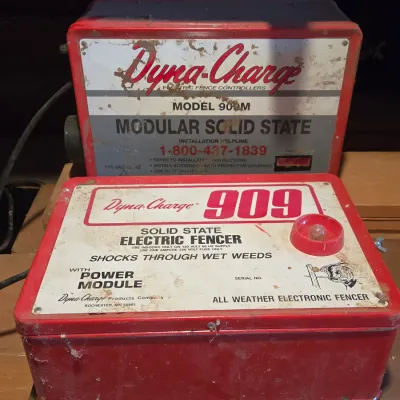 Two Dyna-charge 909 electric fence chargers