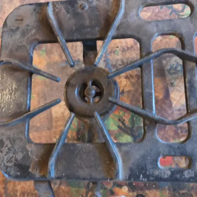 Vintage cast-iron three-burner camp stove with porcelain handles marked 137 on bottom Possibly a Griswold?