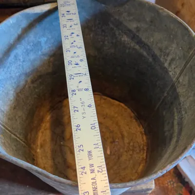 Two vintage metal buckets