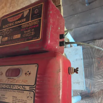 Two electric fence chargers- Paramax Mark III and a Blitzer Scorpion Model 8509 A
