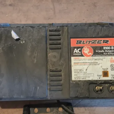 Two electric fence chargers - Blitzer 8900-B and a Hol-Dem model 501