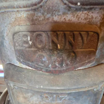Antique cast-iron "oak-style" pot-belly stove, which reads "BONNY OAK" on the upper front door - appears complete and...