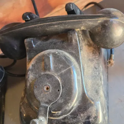 Two Leich Model 901B vintage black Bakelite desk telephones with a hand crank, 1930s or 1940s