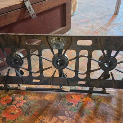 Vintage cast-iron three-burner camp stove with porcelain handles marked 137 on bottom Possibly a Griswold?