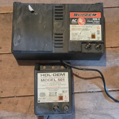 Two electric fence chargers - Blitzer 8900-B and a Hol-Dem model 501
