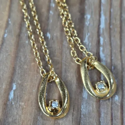 Ladie's Necklaces, cat pin, rings and earrings - Gold toned