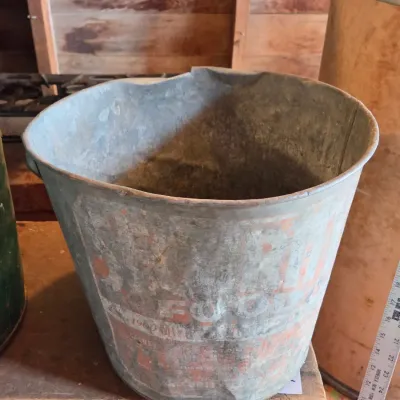 Two vintage metal buckets