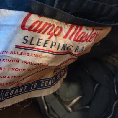 Sealed storage container with 4 sleeping bags - Military down and 2 air mattresses