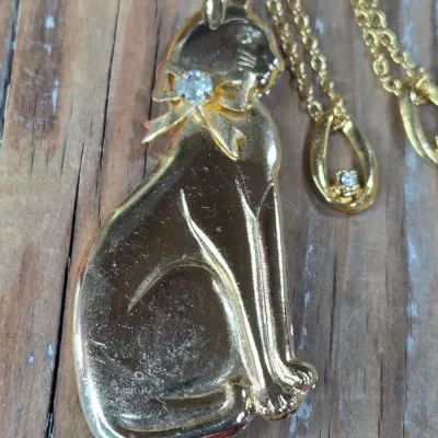 Ladie's Necklaces, cat pin, rings and earrings - Gold toned