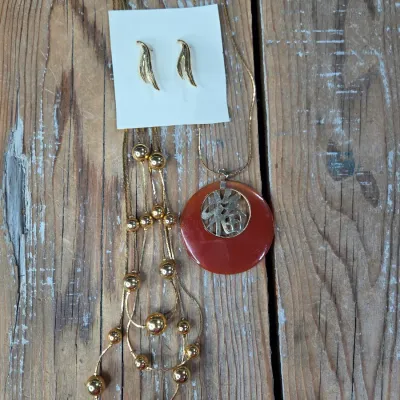 Good fortune necklace with 3 strand gold toned beaded necklace. and a pair of earrings