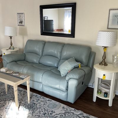 Sale Photo Thumbnail #27: Verdelli piwer sofa, framed mirror, white round end tables, lamps, bench table, rug