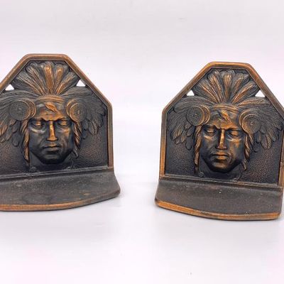 Pr. of antique Judd cast iron book ends w/ Indian and headdress.