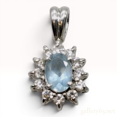 Sale Photo Thumbnail #549: Platinum Oval Aquamarine and Diamond Halo Pendant