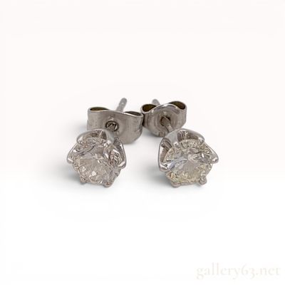 Sale Photo Thumbnail #147: A Pair of 1.5ctw Platinum and Round Brilliant Cut Colorless Natural Diamond Stud Earrings