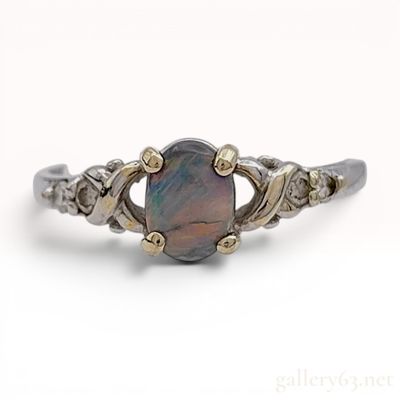 Sale Photo Thumbnail #184: An 18 Karat Two-Tone Gold Black Opal and Diamond Ring