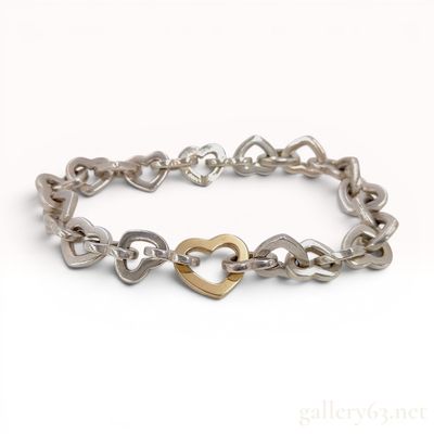 Sale Photo Thumbnail #420: Tiffany & Co. 18K Gold & Sterling SilverHeart Link Bracelet