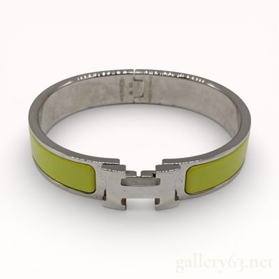 Sale Photo Thumbnail #125: Hermes Clic H bracelet in citron yellow enamel and palladium-plated metal