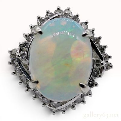 Sale Photo Thumbnail #36: A 2.41ct Australian Opal and.50ctw Diamond Halo Cocktail Ring in Platinum