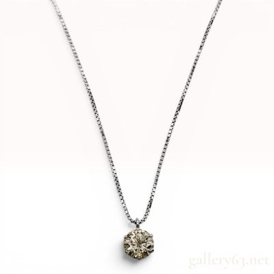 Sale Photo Thumbnail #615: A Solitaire Diamond Pendant Necklace in Platinum and 18-Karat White Gold