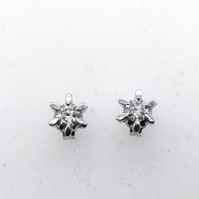 Sale Photo Thumbnail #221: A Pair of Diamond and Platinum Flower Style Stud Earrings