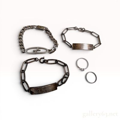 Sale Photo Thumbnail #328: A Collection of Silver Jewelry Including ID Bracelets and Rings