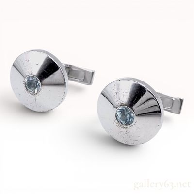 Sale Photo Thumbnail #533: A Pair of Cartier Sterling Silver and Blue Topaz Round Cufflinks