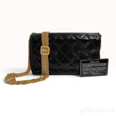 Sale Photo Thumbnail #497: An Important Chanel Vintage Black Quilted Lizard Skin Flap Bag with Multi-Strand Gold-Plated Chain, 0 Series 1984-1986