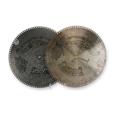 Sale Photo Thumbnail #83: A Pair of Regina Music Box Discs, 15.5-Inch, 1896-1897
