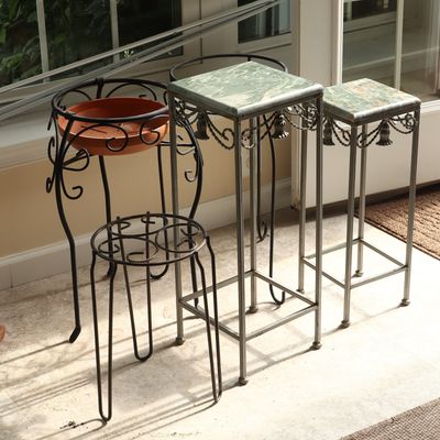 A Collection of Five Mixed Metal and Stone Plant Stands and Pedestals