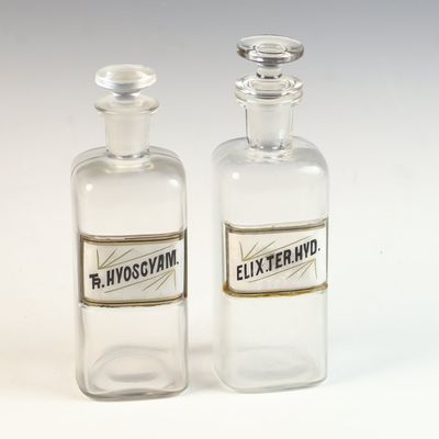 A Pair of Whitall Tatum Company Clear Glass Apothecary Bottles