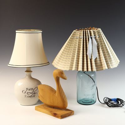 A Trio of Decorative Items Including Two Table Lamps and a Carved Wood Swan Sculpture