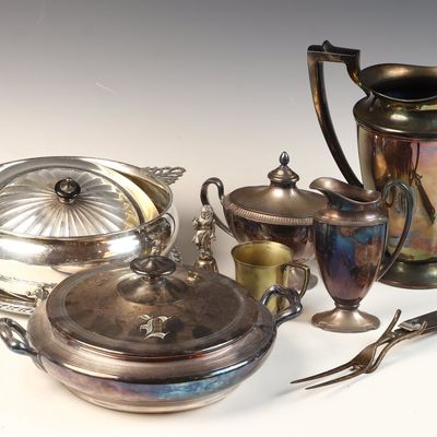 An Assortment of Silver-Plated Table Articles Including a Water Pitcher and Lidded Serving Dishes
