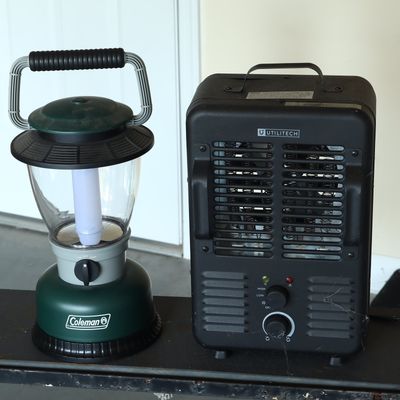 A Coleman Portable Lantern and a Utilitech Electric Space Heater