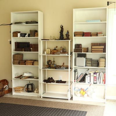 A Trio of White Finished Shelving Units Including a Matching Pair of Tall Bookcases
