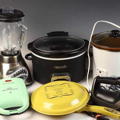A Collection of Six Kitchen Appliances Including Crock-Pot, Oster, and Hamilton Beach