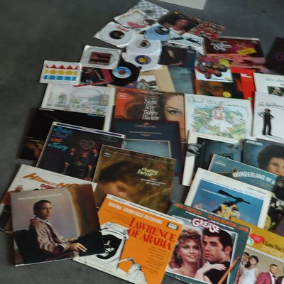 A Collection of Vinyl LP Records and 45 RPM Singles Including Pop Rock and Film Soundtracks