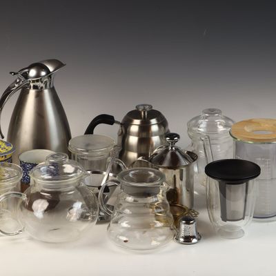 An Assortment of Contemporary Tea Brewing and Serving Vessels in Glass and Stainless Steel