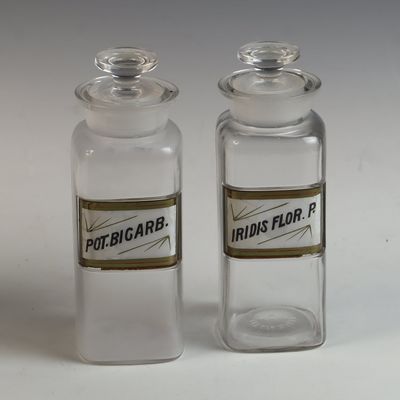 A Pair of Whitall Tatum and Company Under Glass Label Apothecary Jars