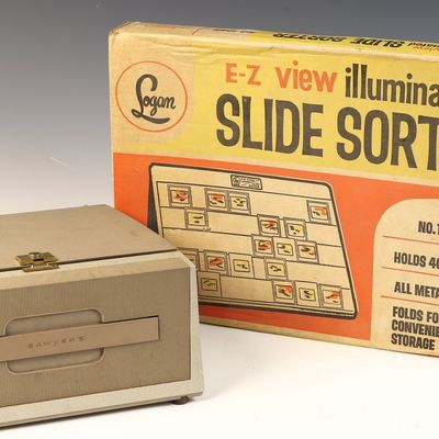 A Sawyer's 500 Slide Projector and a Logan E-Z View No. 1055 Illuminated Slide Sorter