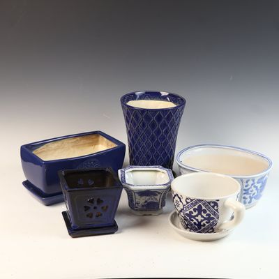 An Assortment of Blue and White Glazed Ceramic Planters and Vessels