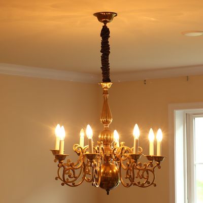 Flemish Style Eight Light Brass Chandelier