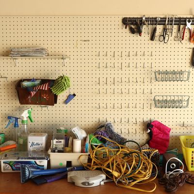 An Assortment of Household Cleaning Supplies Electrical Accessories and Hand Tools